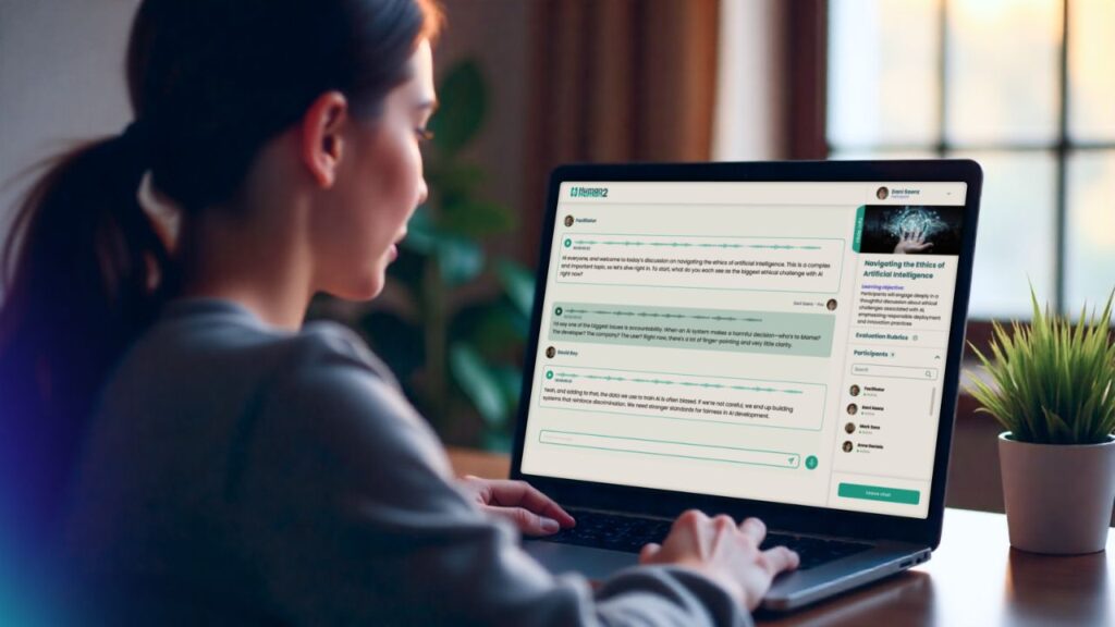 Student using a laptop to interact with the H2H AI Facilitator platform during an AI-guided discussion activity